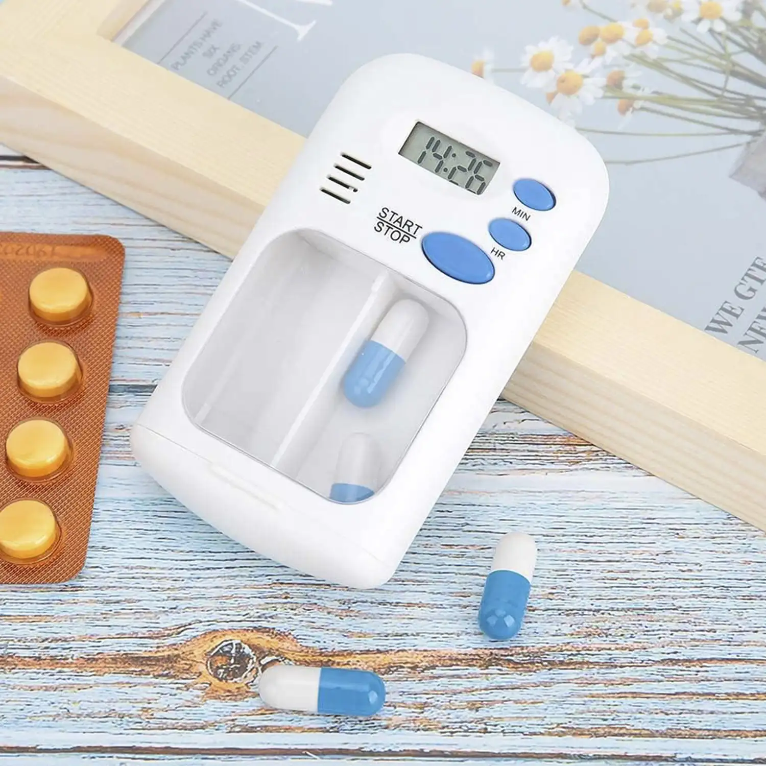 Pastillero con doble compartimento y alarma con temporizador.