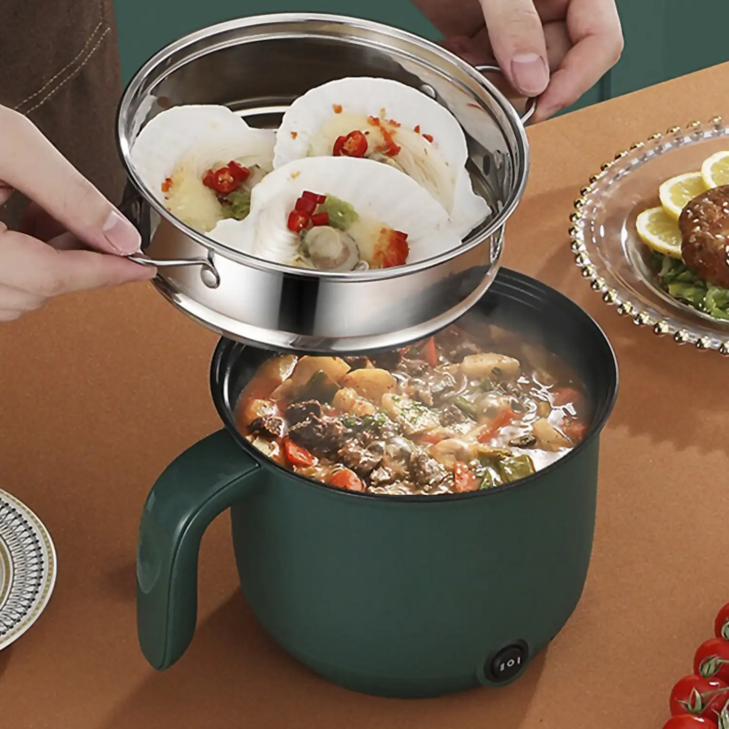 Olla multifunción eléctrica: arrocera, vaporera, pota. Aislamiento térmico exterior, control temperatura, fondo antiquemado. Libre BPA, grado alimentario.