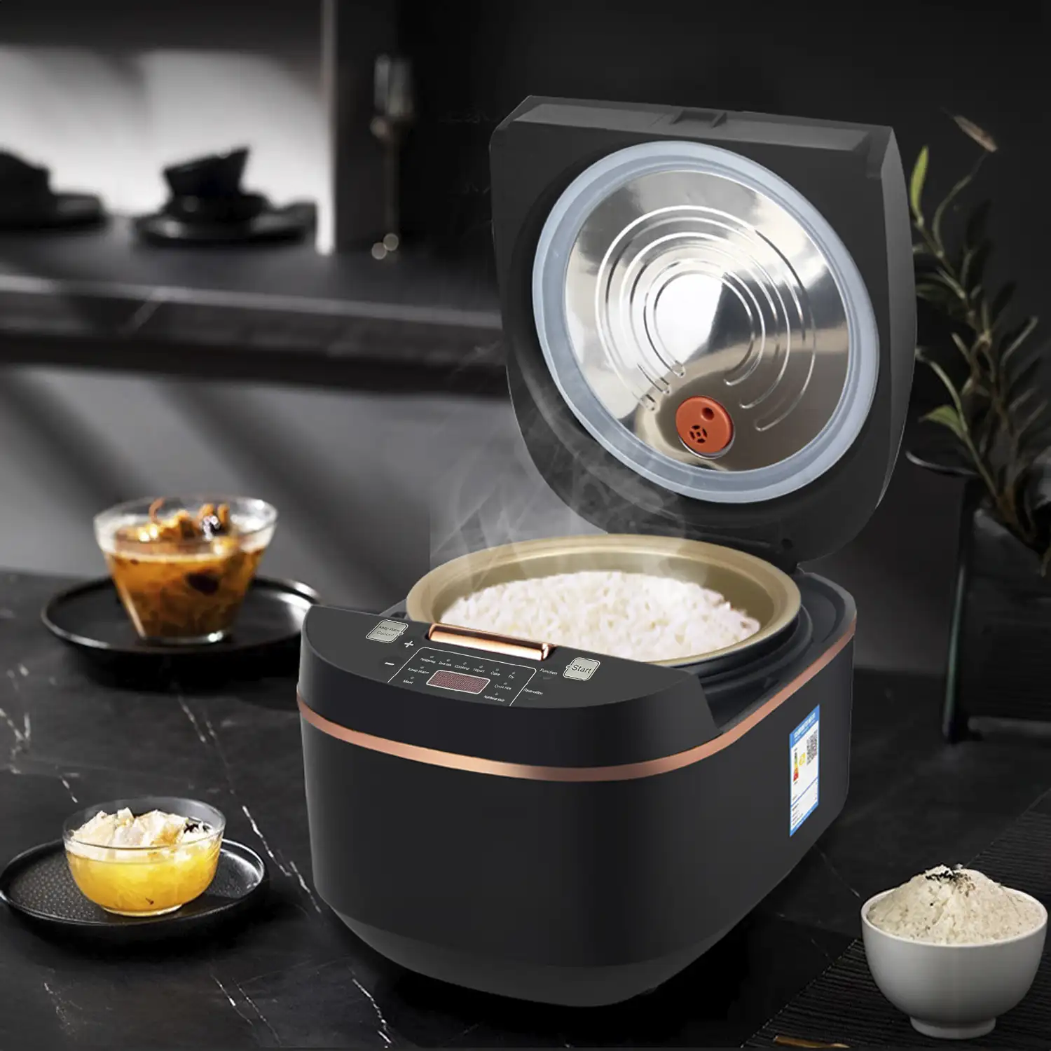 Arrocera eléctrica de calor tridimensional y 900W. Funciones y programas de cocina pregrabados. Cuenco antiadherente de 5 capas y con 5L de capacidad.