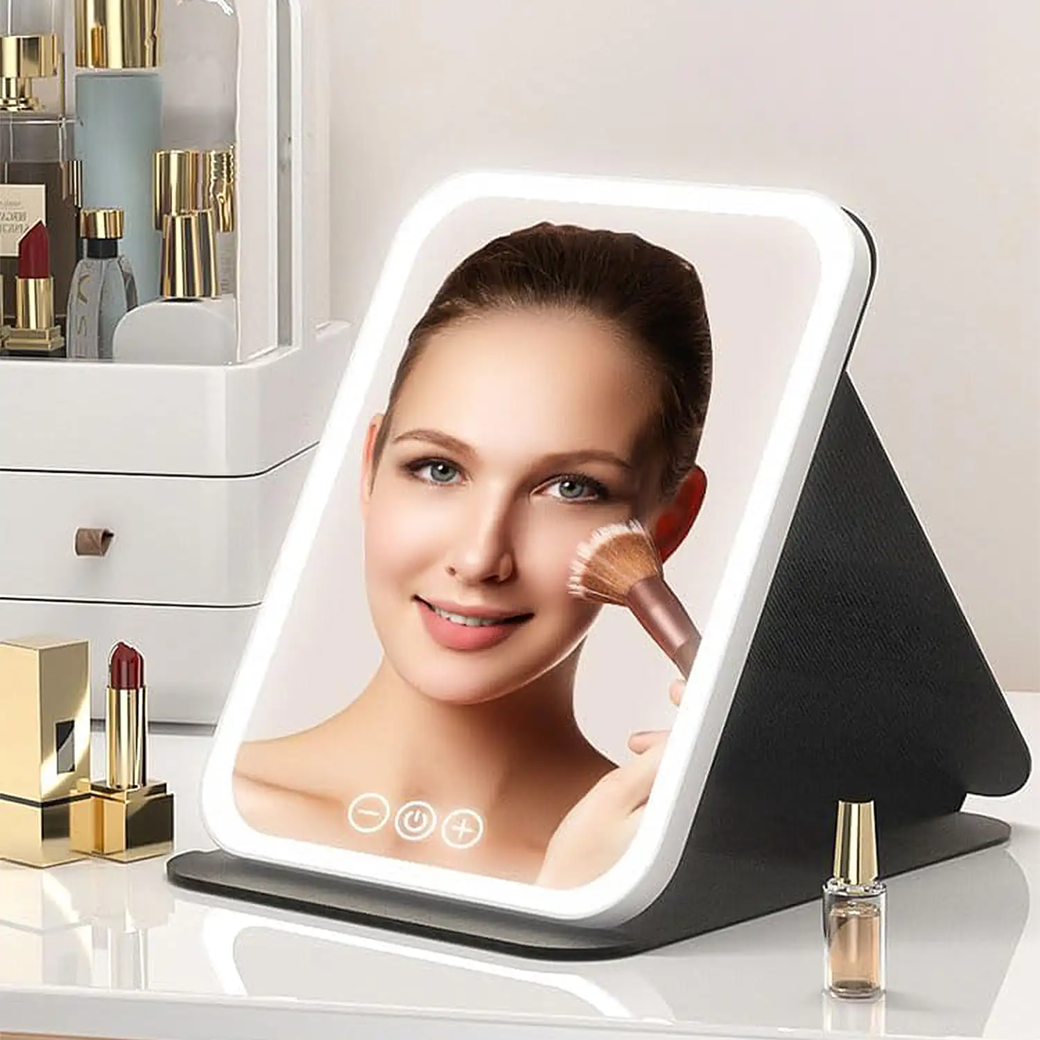 Espejo de maquillaje plegable, con luz led fría, normal y cálida, intensidad regulable. Tamaño compacto.