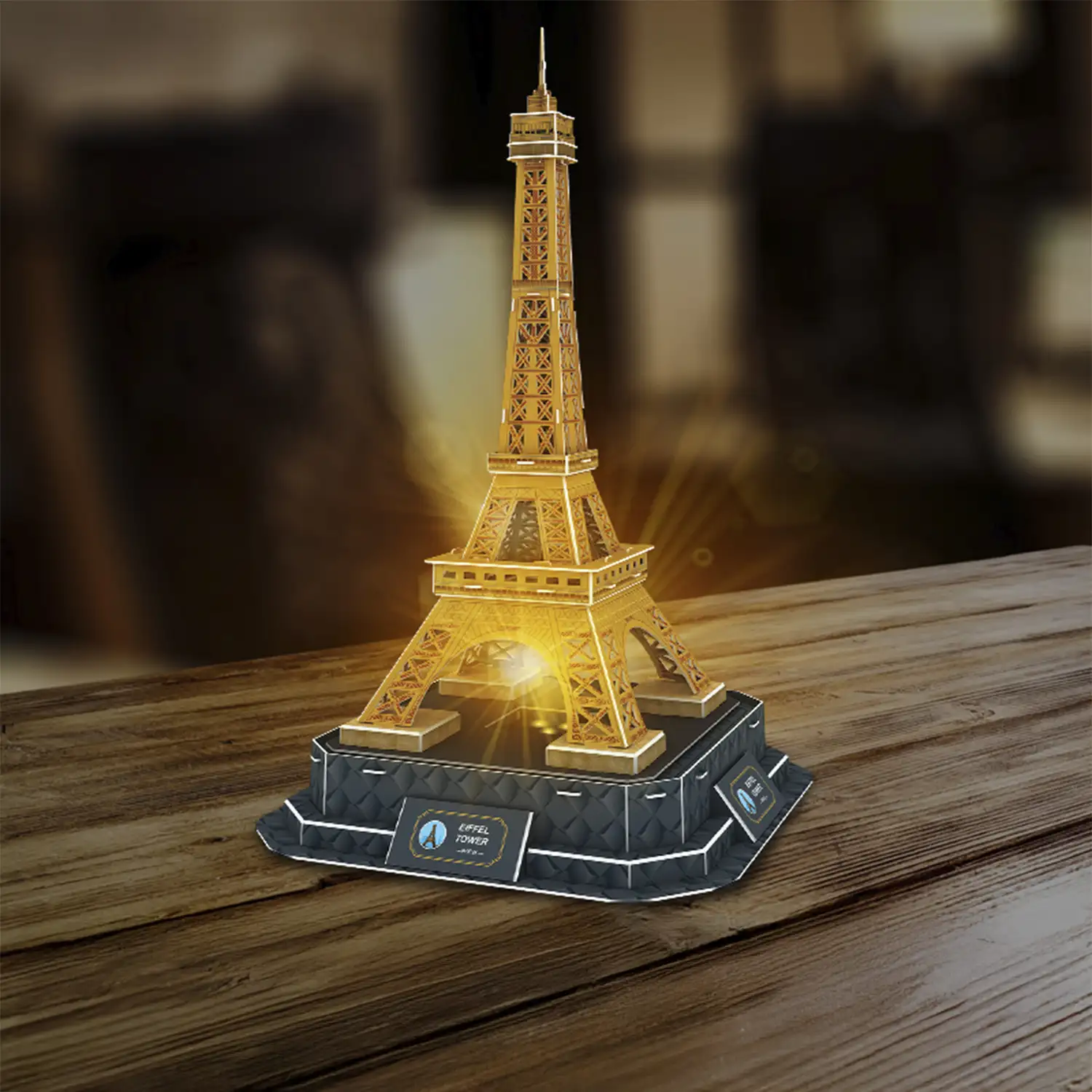 Puzle 3D de cartón de la Torre Eiffel en París. Base con luces y música. 47 piezas.